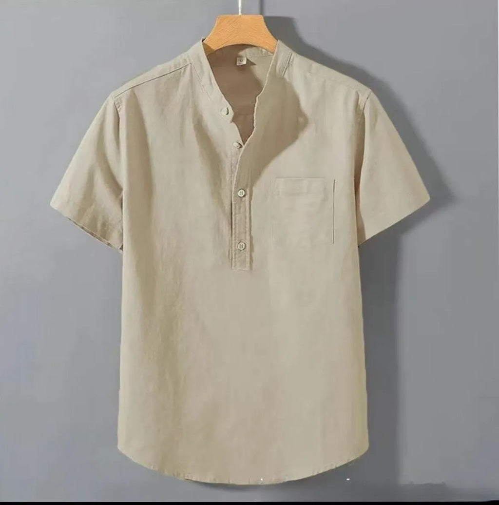 Man wearing a beige slub linen casual shirt with a stand collar and short sleeves, loose fit.