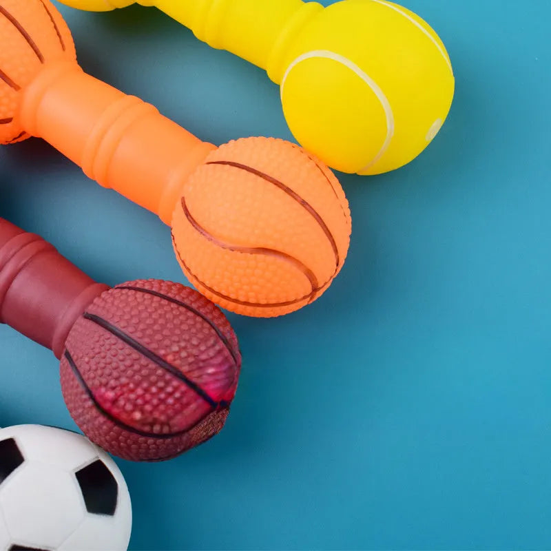 Football dumbbell shaped squeaky dog chew toy in orange colour
