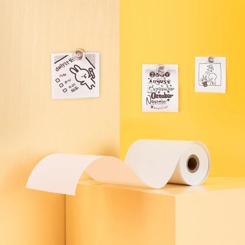 Three rolls of 57mm wide white thermal paper on a 30mm core, packaged together.