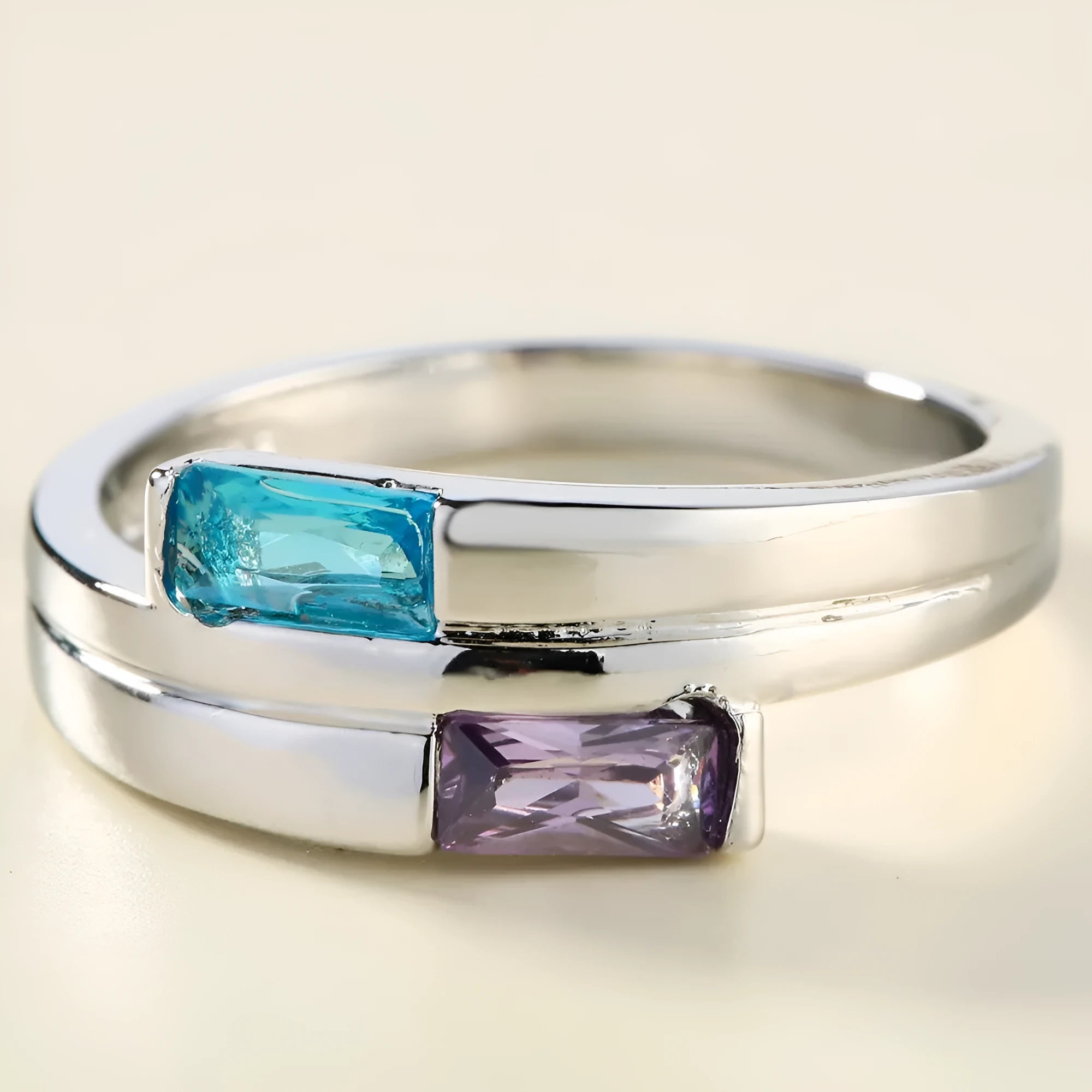 Silver electroplated copper ring with inlaid zircon details on a hand