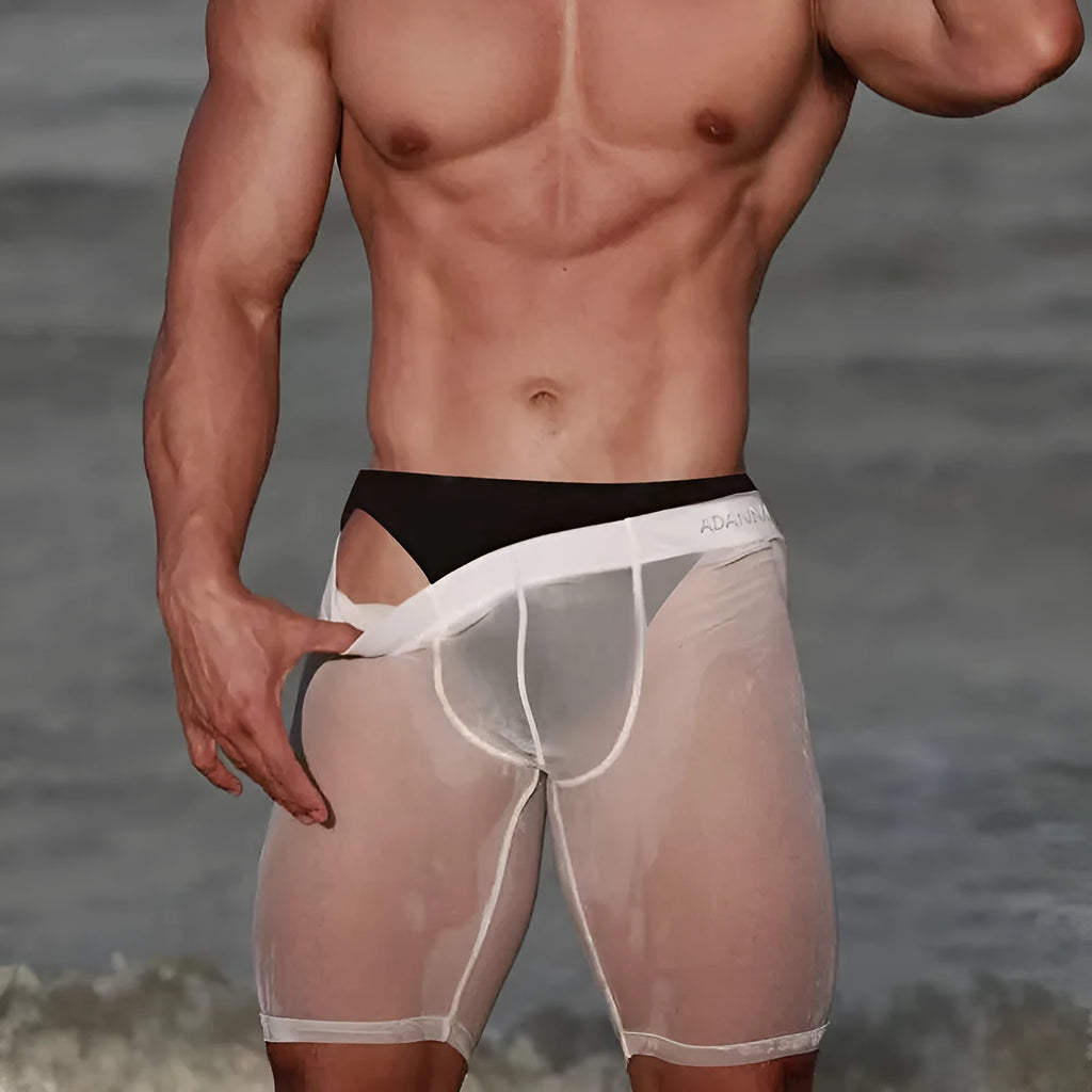 Men's solid colour seamless nylon lounge shorts in black, shown on a model.