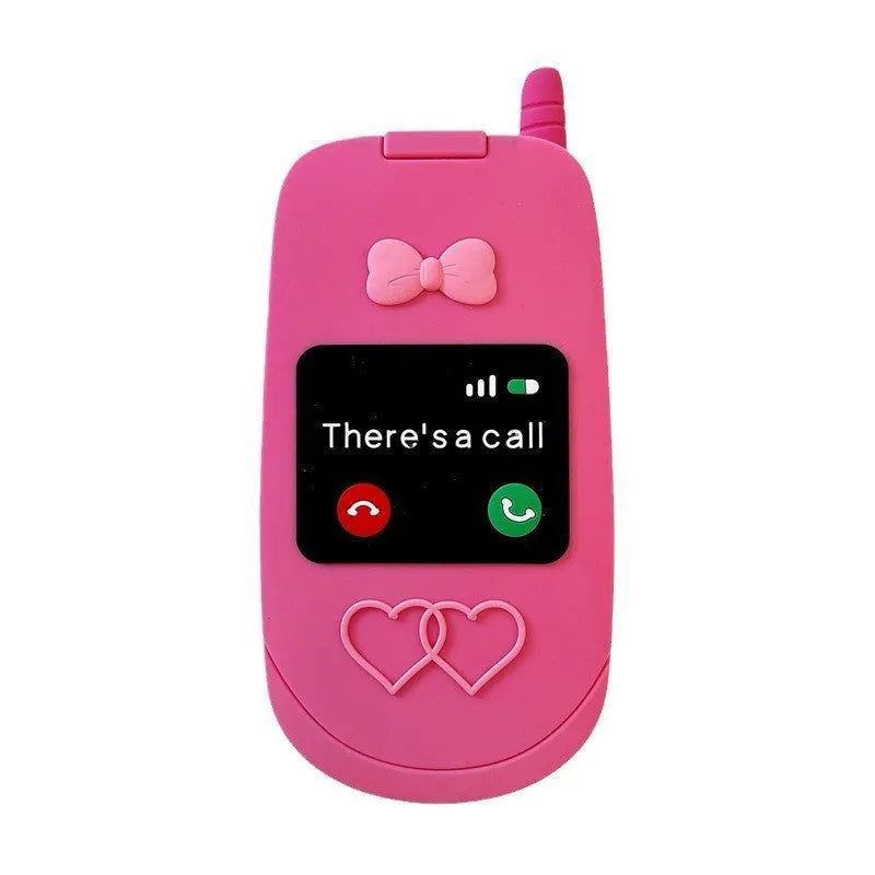 Pink silicone flip phone-shaped iPhone case with a built-in mirror and cute cartoon design.