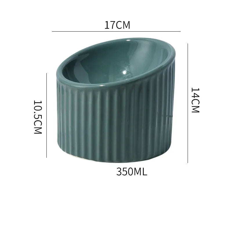 Dark green ceramic elevated cat bowl with tilted, round design for food or water.