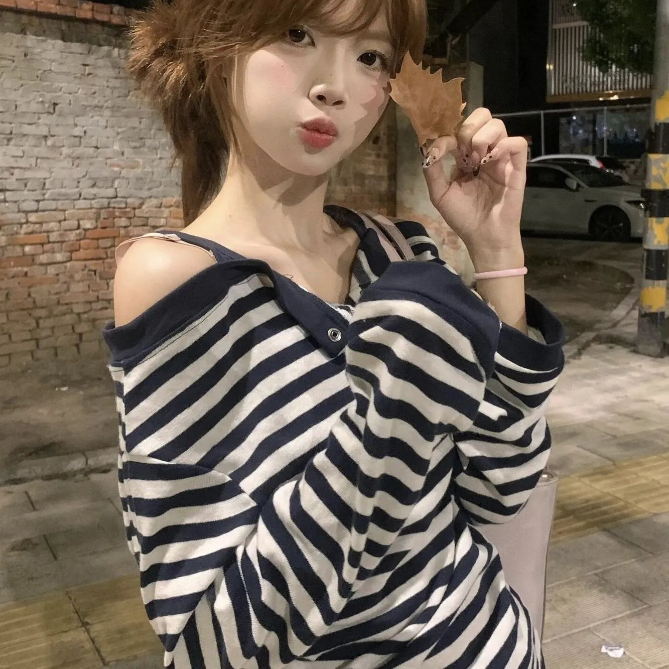 Dark blue Korean-style oversized women's t-shirt with embroidery and stripe details on long sleeves