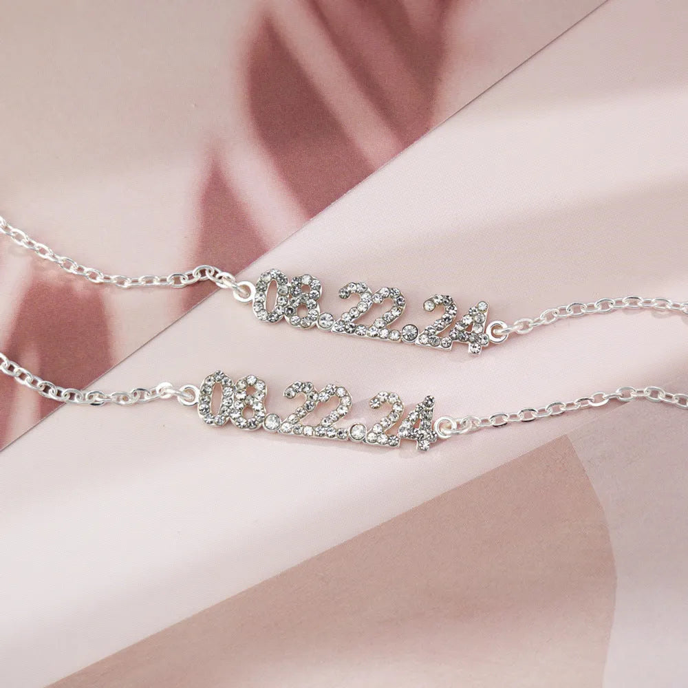 Stainless steel digital bracelet with diamond studded numbers, matching necklace option