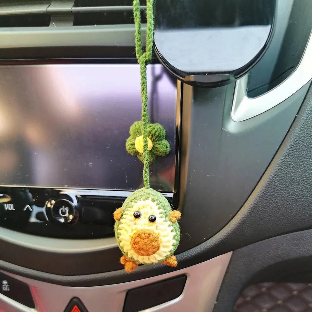 Handmade crocheted wool car pendant with rainbow colours hanging from car mirror