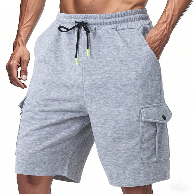 Men's loose fit cargo shorts in terry fabric with multiple pockets available in light grey, black, and dark grey colours