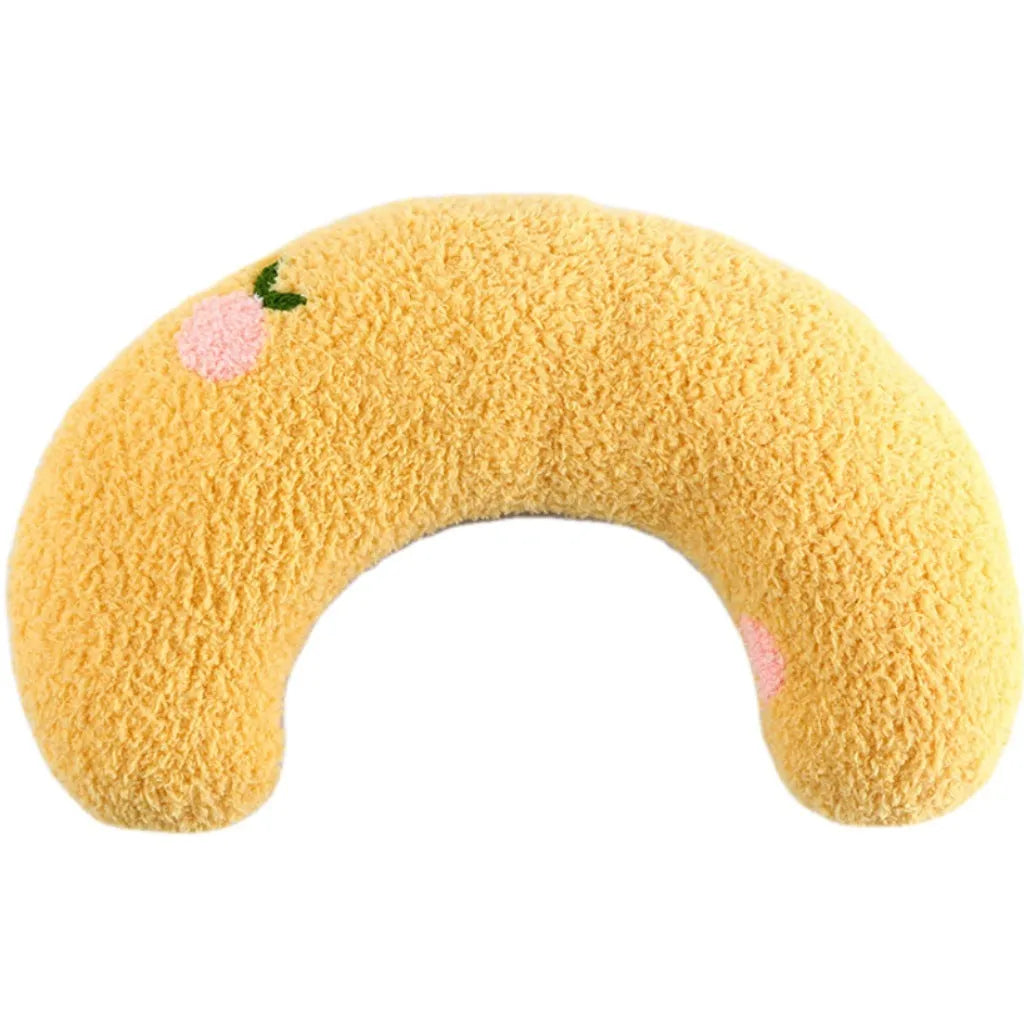 Small blue U-shaped plush pillow for cats or small dogs on a white background.
