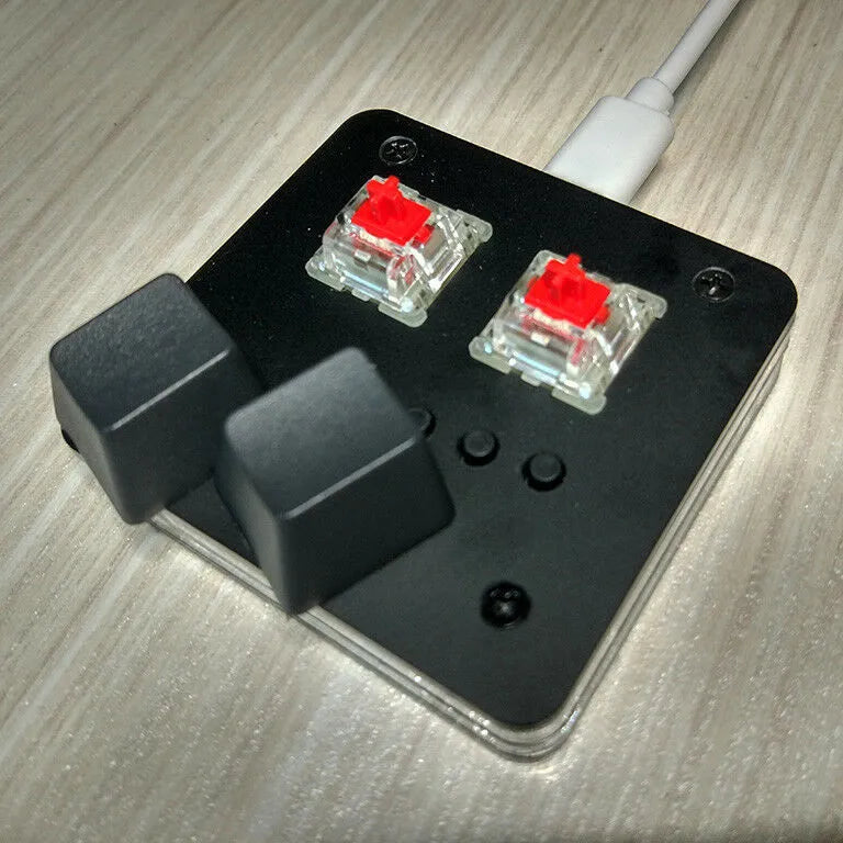 Compact white plastic USB keyboard with a touch panel and multimedia keys.