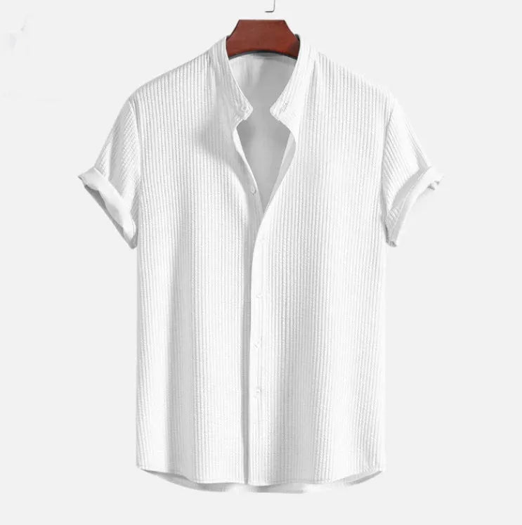 Men's loose fit short sleeve polyester summer shirt on a hanger, shown in a light blue colour.