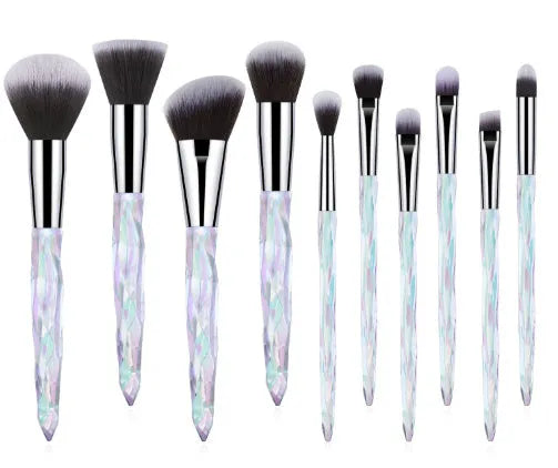 Ten crystal-handled foundation brushes with artificial fibre bristles in black, blue, red, and yellow.