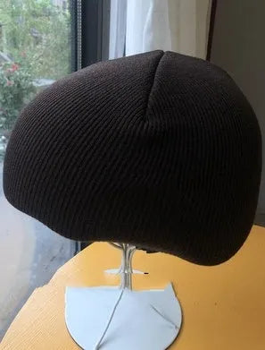A size L decorative cover for a ski helmet, shown in one of fifteen available colour options.