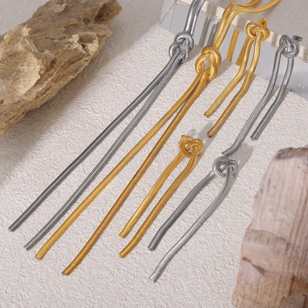 Gold electroplated titanium steel necklace and earrings set with snake chain and knotted tassel design