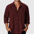 Men's loose fit long sleeve beach shirt with stand collar on a mannequin.