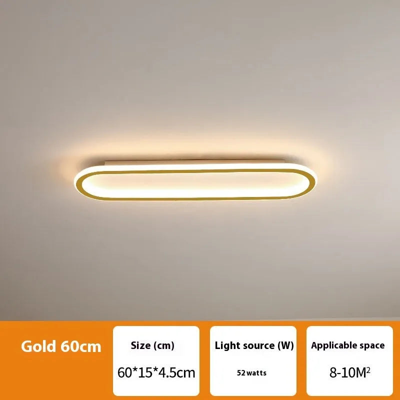 Minimalist black strip ceiling lamp with aluminium body and PVC shade mounted on a white ceiling.