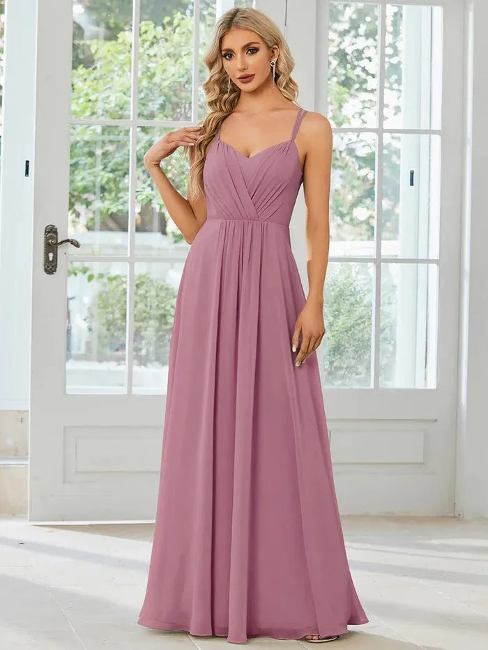 Women's sleeveless pleated A-line long dress in light green, shown in a solid colour with a long skirt.