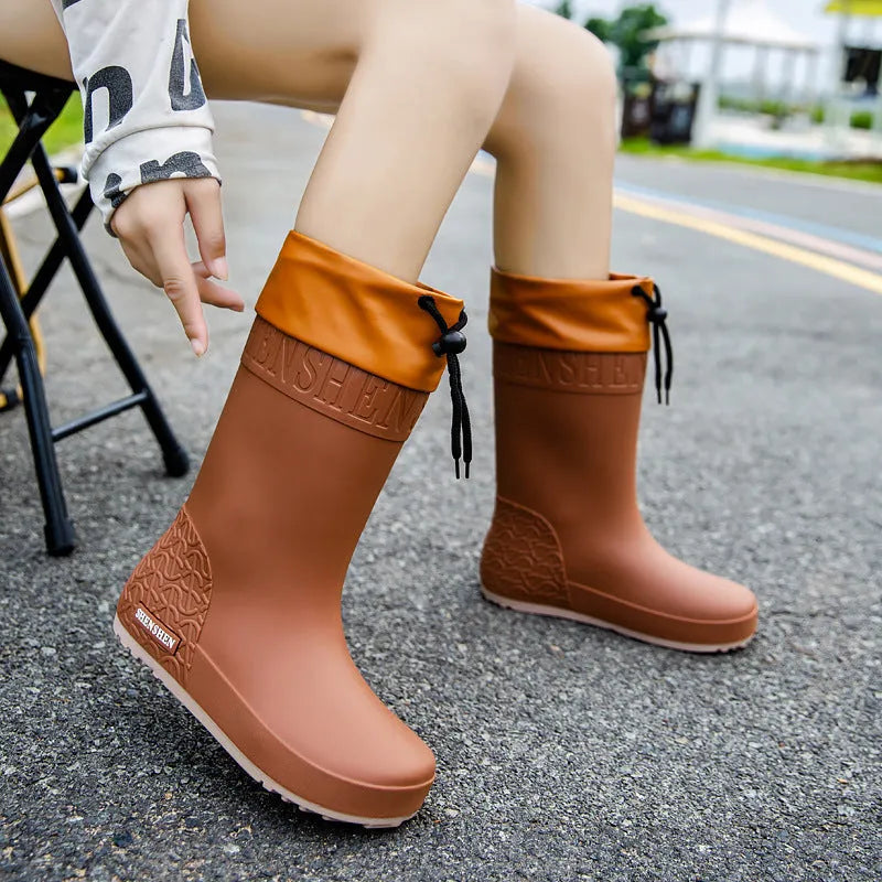 Women's PVC rain boots in solid colours with non-slip soles and waterproof mouth design