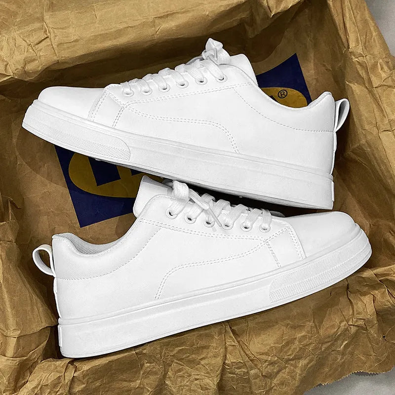 Men's white and black Korean-style low-top casual sneakers with round toe and flat heel.