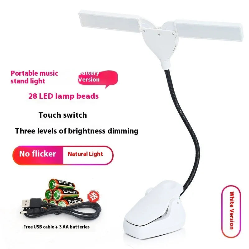 Rechargeable black music stand light with 28 lamps and USB cable on a music stand.