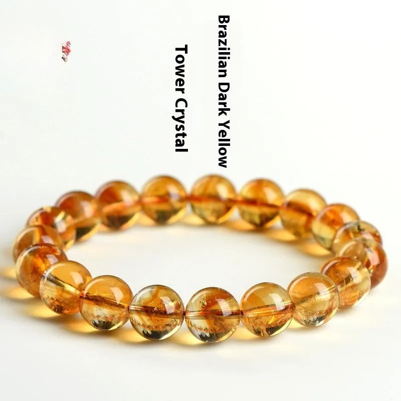 Natural yellow citrine gemstone bead bracelet showing geometrical beads on a string.