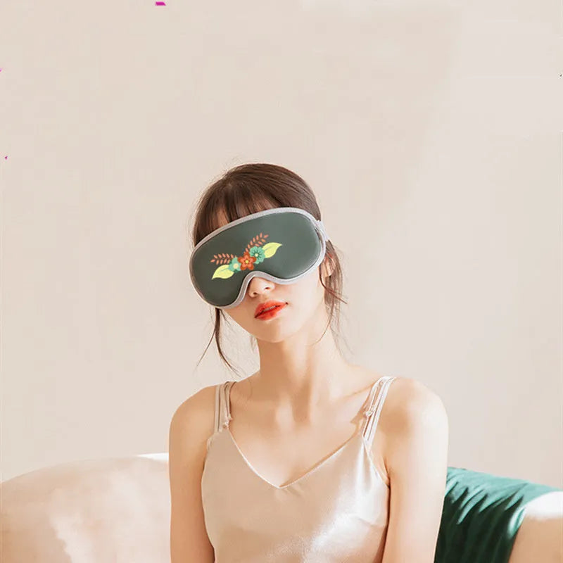 Portable eye SPA mask with steam and vibration massage functions in green or pink colours