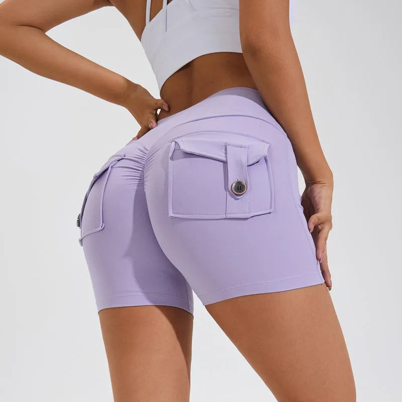 Women's high waist hip lifting sports shorts with side pockets in electric blue colour