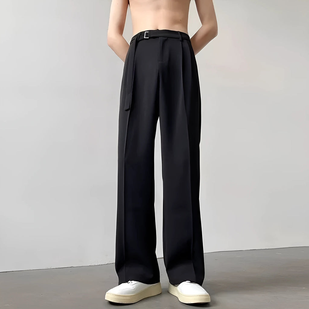 Black thin straight wide leg trousers on a hanger, showing loose fit and straight leg opening.