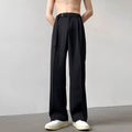 Black thin straight wide leg trousers on a hanger, showing loose fit and straight leg opening.