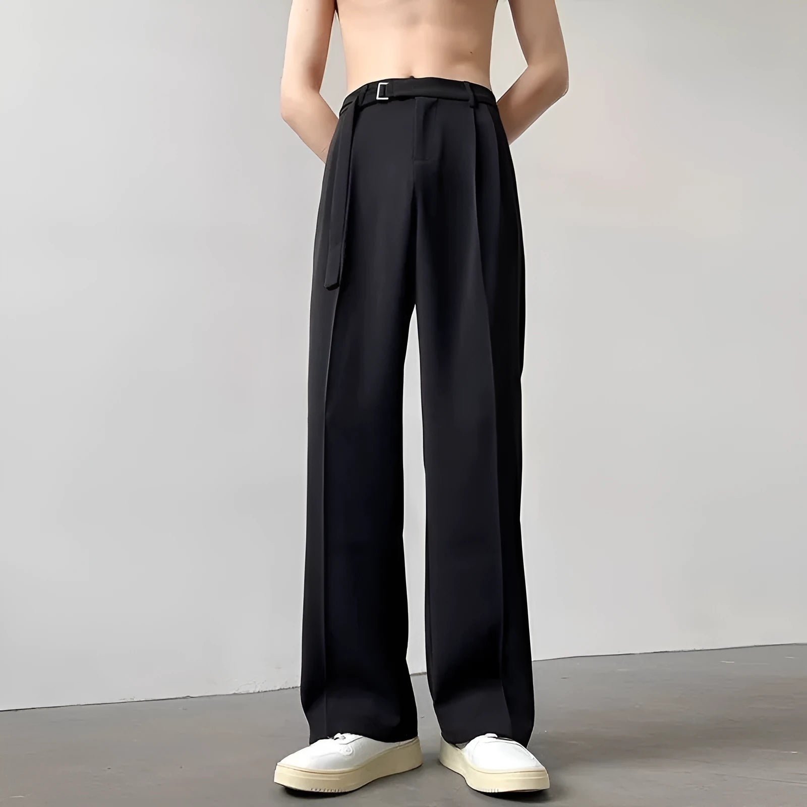 Black thin straight wide leg trousers on a hanger, showing loose fit and straight leg opening.