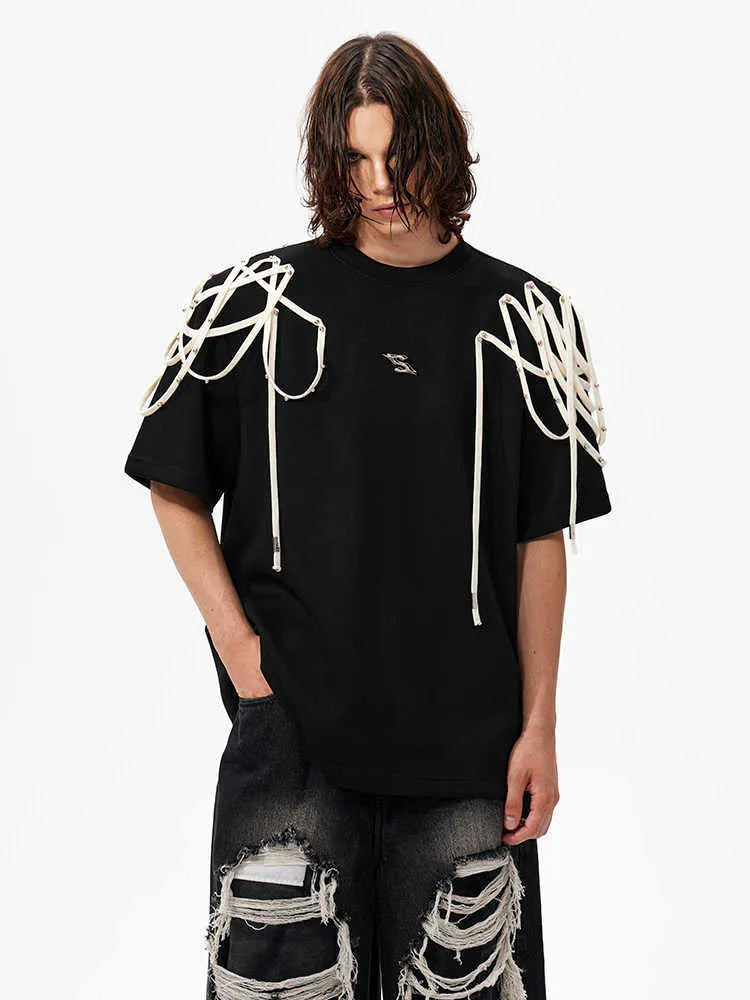 Black loose-fit short-sleeved T-shirt with a decorative rivet and ribbon padded shoulder detail.