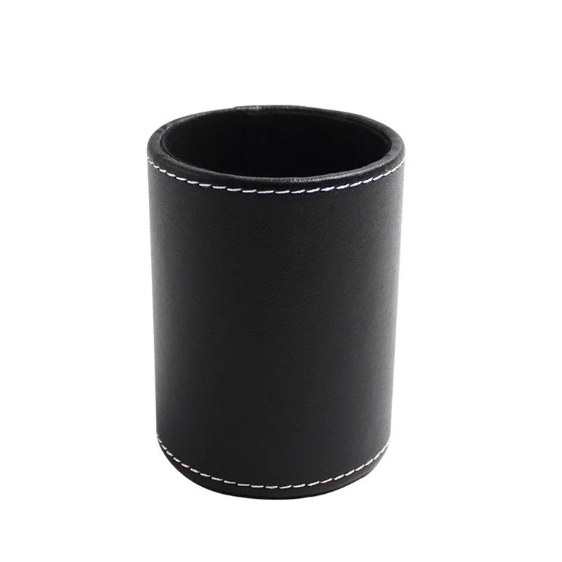 Round black leather pen container showing cylindrical shape and compact size for desk organisation.