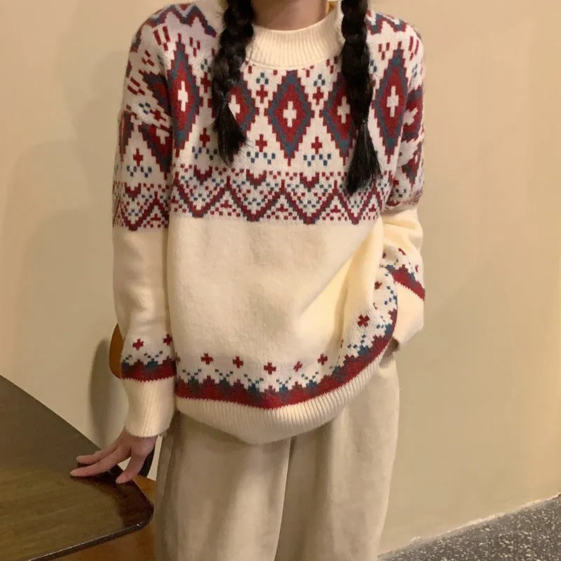 Red and white striped loose fit pullover knitted top with long sleeves on a mannequin.