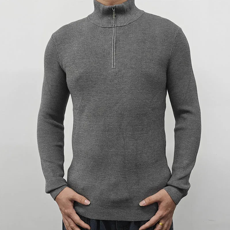 Man wearing a grey cotton blend half-turtleneck zip sweater with long sleeves