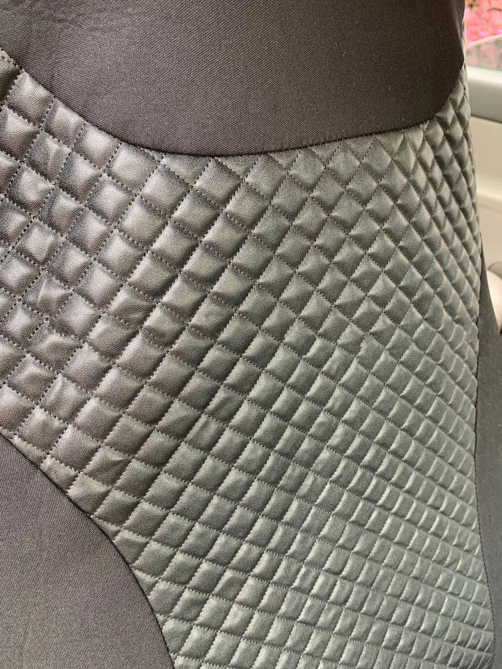 Black quilted PU universal car seat cover with sponge padding and attachment hooks