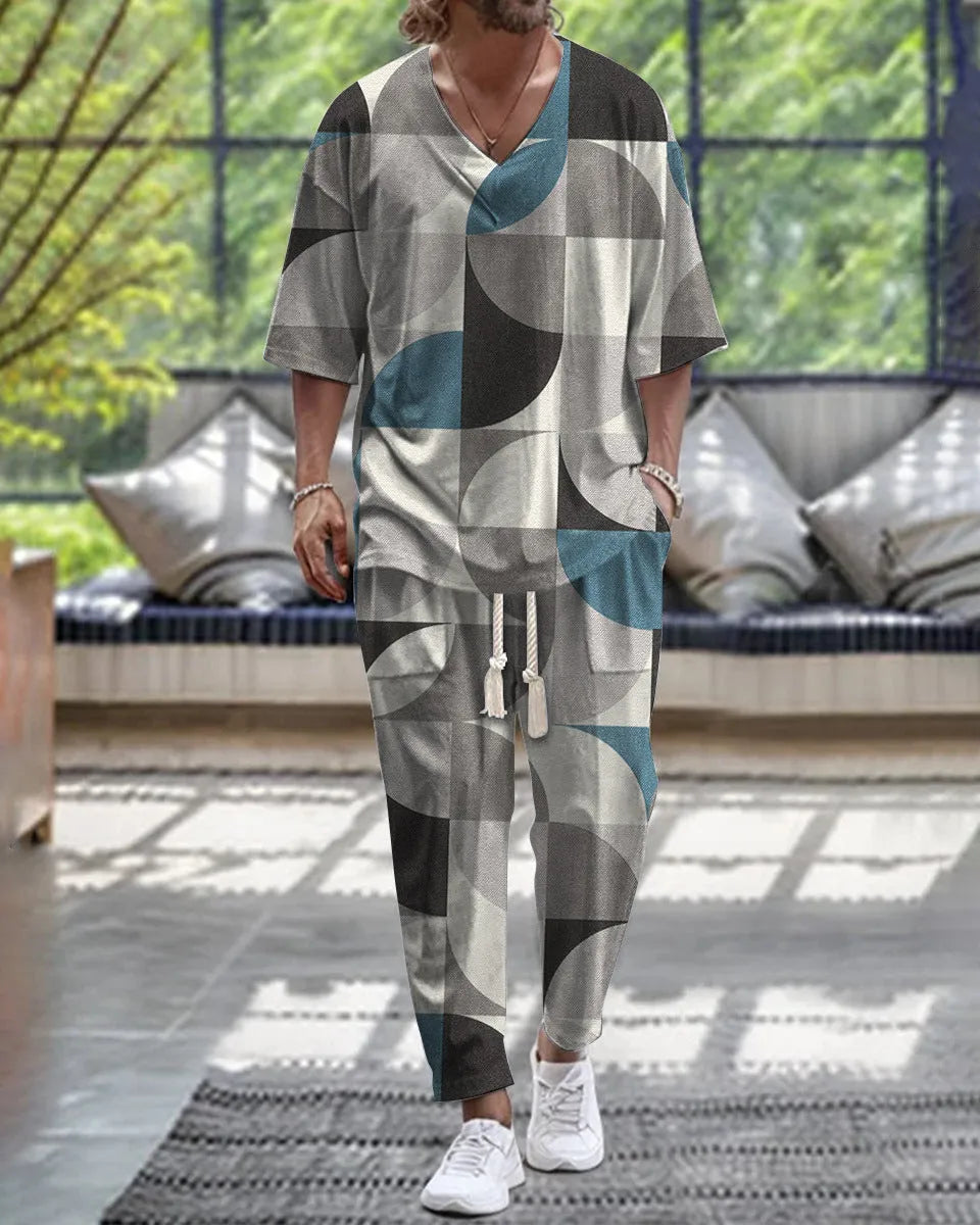 Men's light grey cropped sleeve V-neck suit jacket and trousers on a hanger.