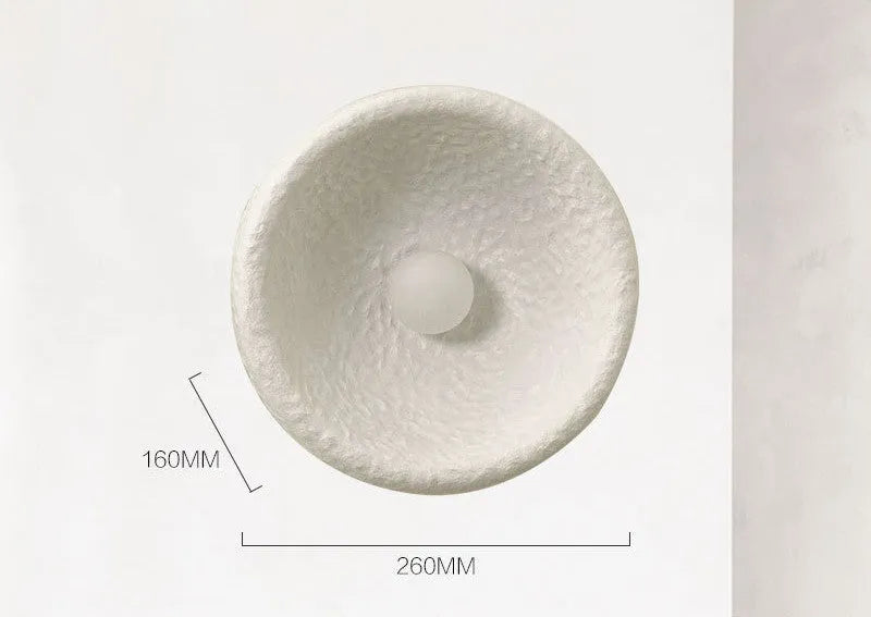 Japanese-style simple silent wall lamp with resin shade in warm white light.