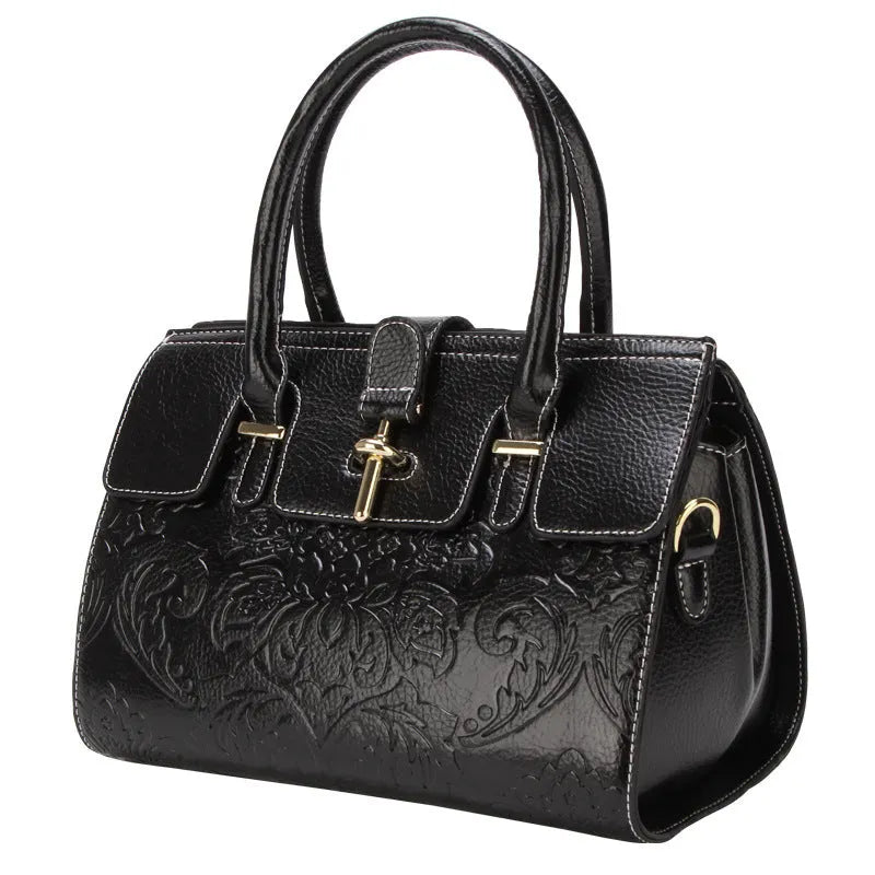 Oval vintage embossed genuine leather crossbody bag showing internal compartments