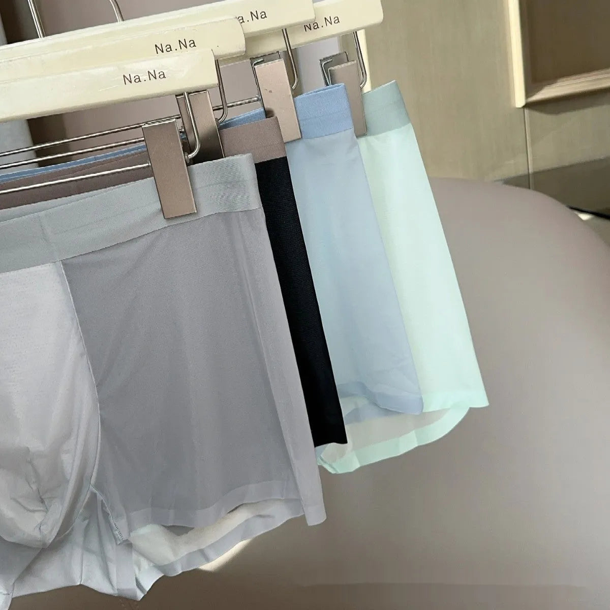 Men's seamless antibacterial boxer shorts in ice silk fabric showing honeycomb crotch detail.