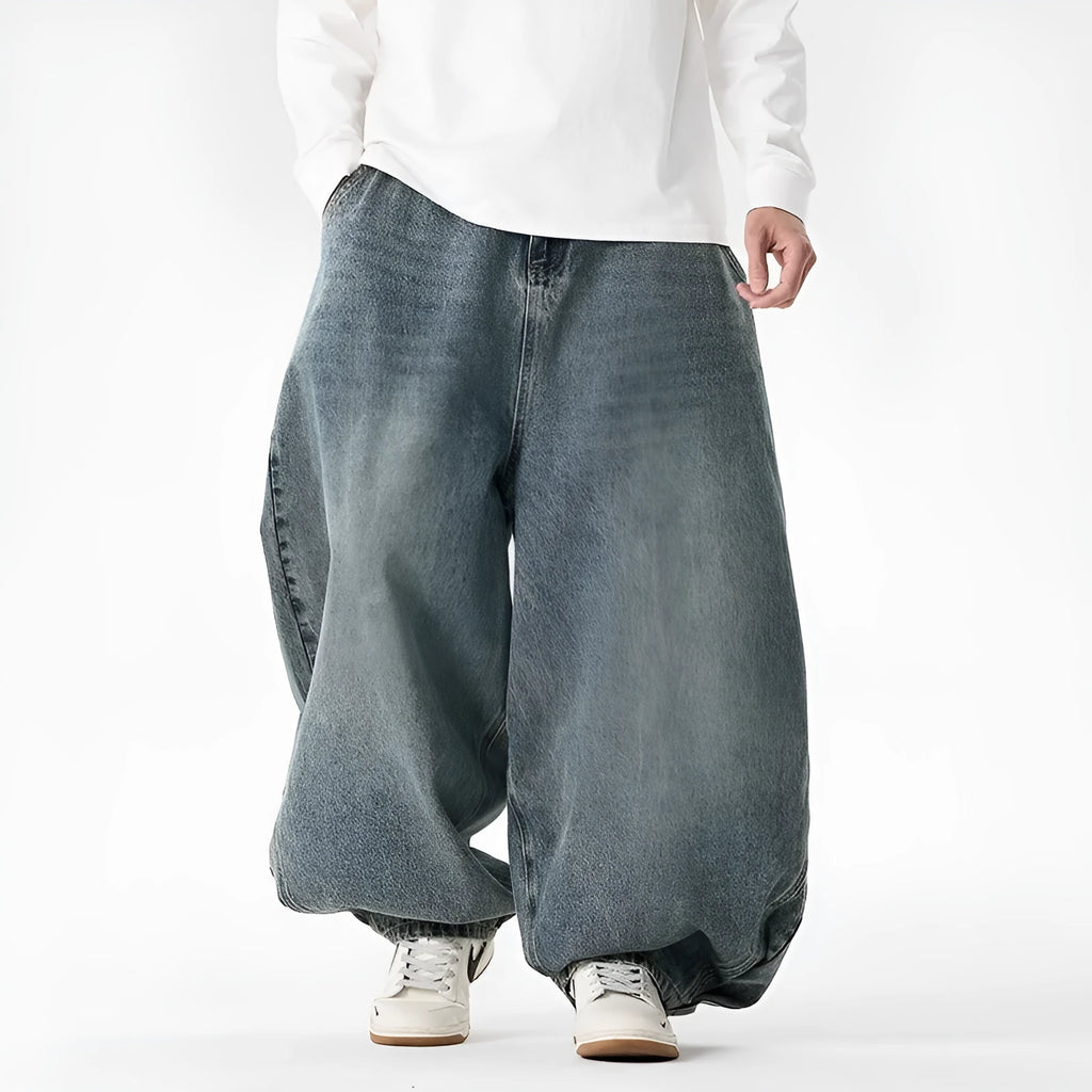 Men's plus size light blue wide leg baggy jeans on a neutral background
