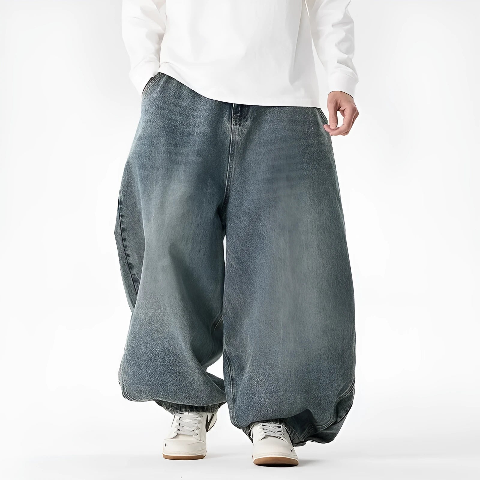 Men's plus size light blue wide leg baggy jeans on a neutral background