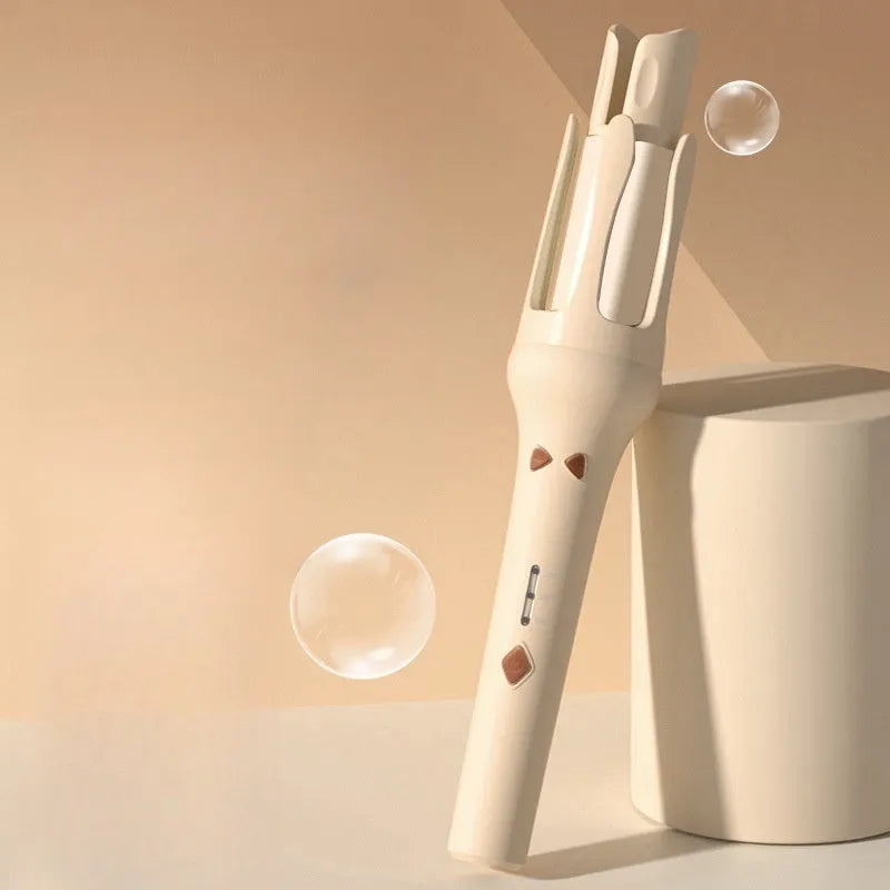 Automatic hair curler with 32mm ceramic barrel in pink, showing wired power cord and included US/EU travel adapters.