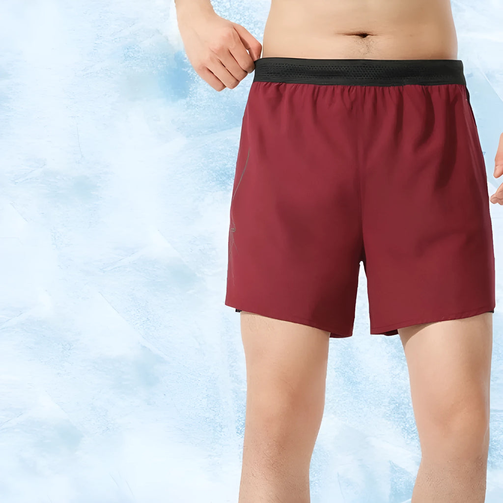 Men's solid colour low-waist basketball shorts made from polyester, shown in a selection of available colours.