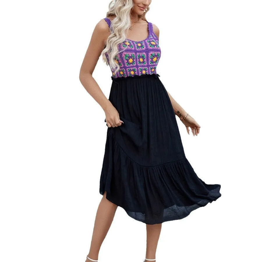 Purple sleeveless dress with hand-hooked floral embroidery pattern, modelled on an adult woman.