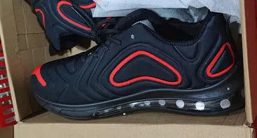 Men's black casual sneakers with a thick sole and lace-up design.