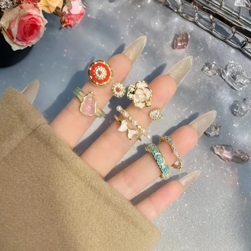 Copper adjustable ring with gourd design, flower and bow shapes, inlaid zircon detailing