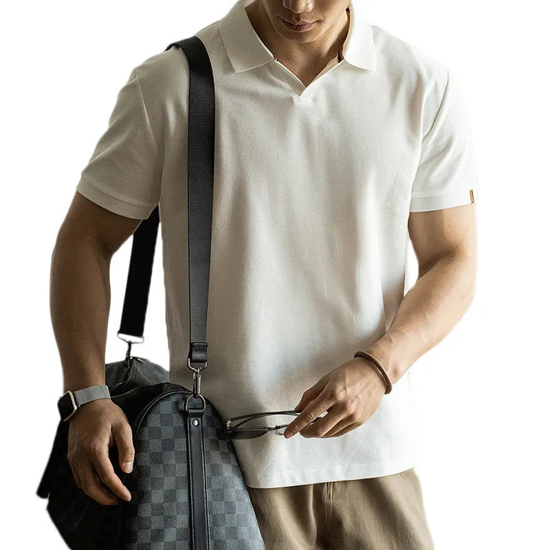 Blue cotton polyester blend short-sleeved polo shirt on a hanger, showing regular fit and casual style.