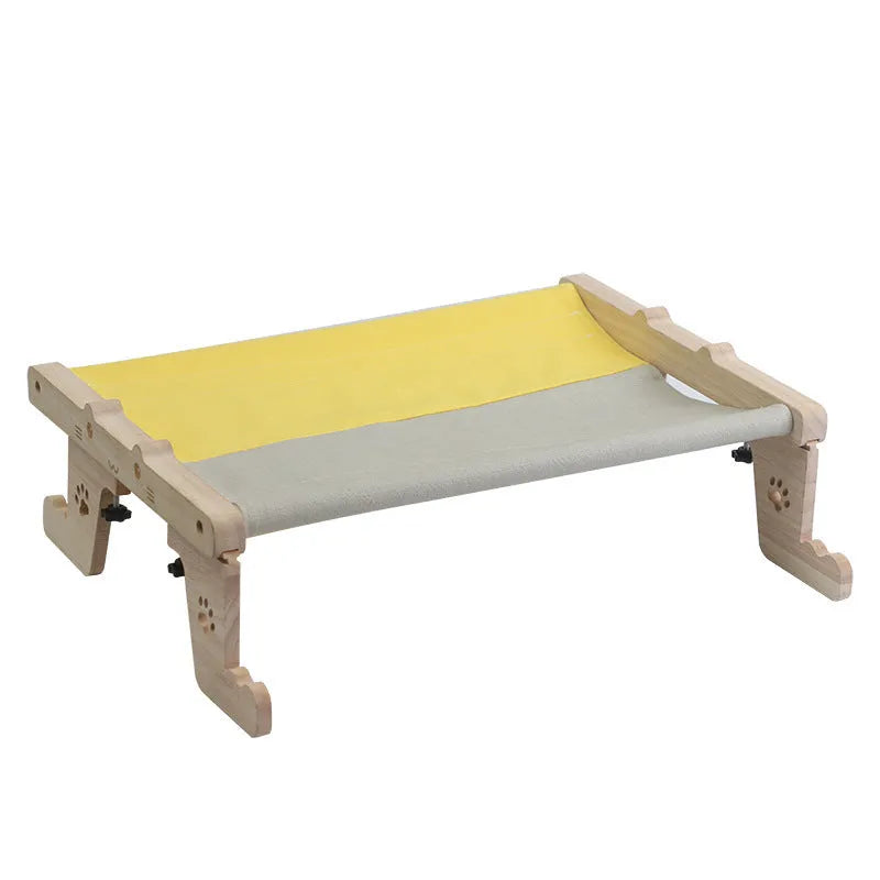 Wooden cat hanging bed hammock mounted on a balcony railing