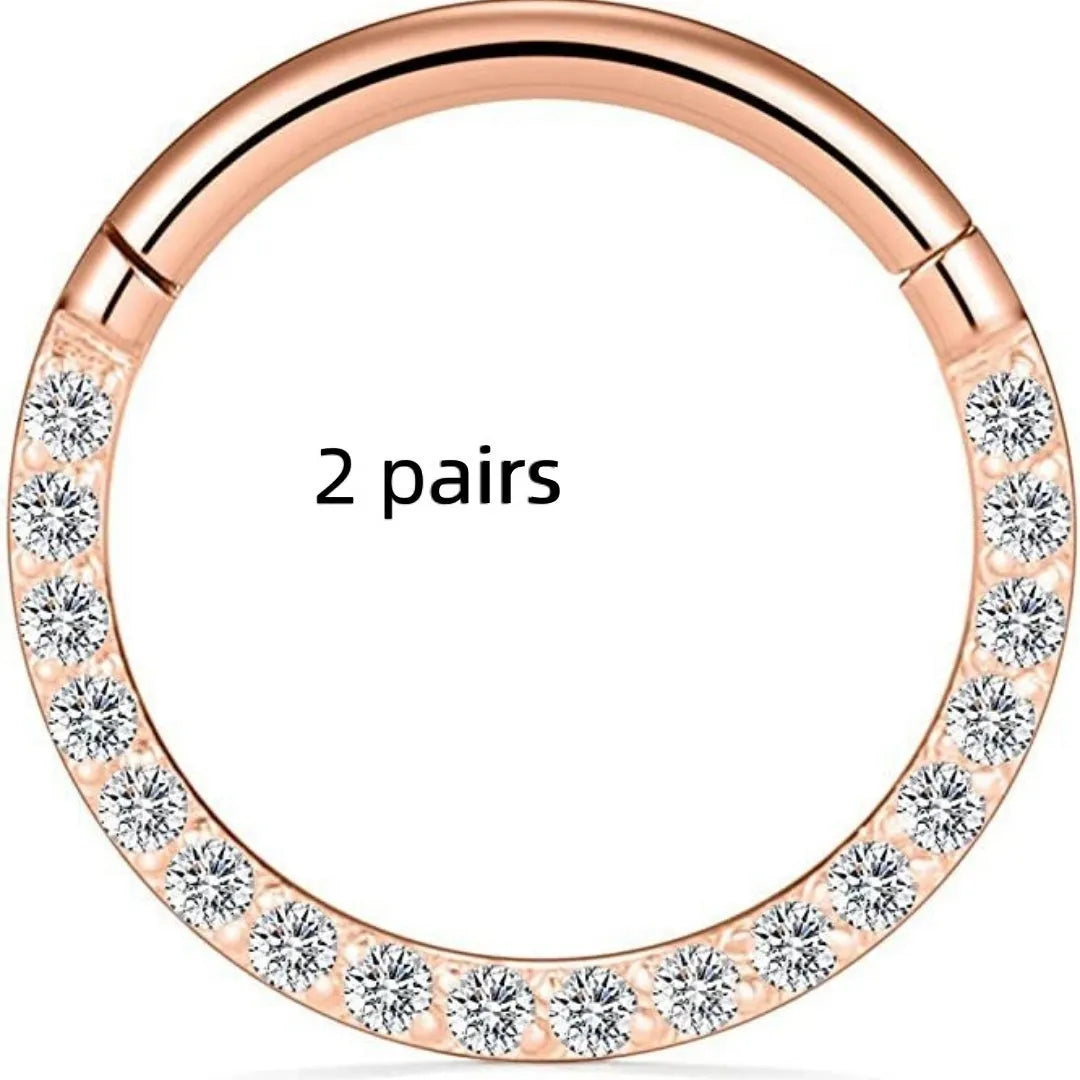 Stainless steel seamless nose rings showing steel, gold, rose gold, and black electroplated finishes with round design