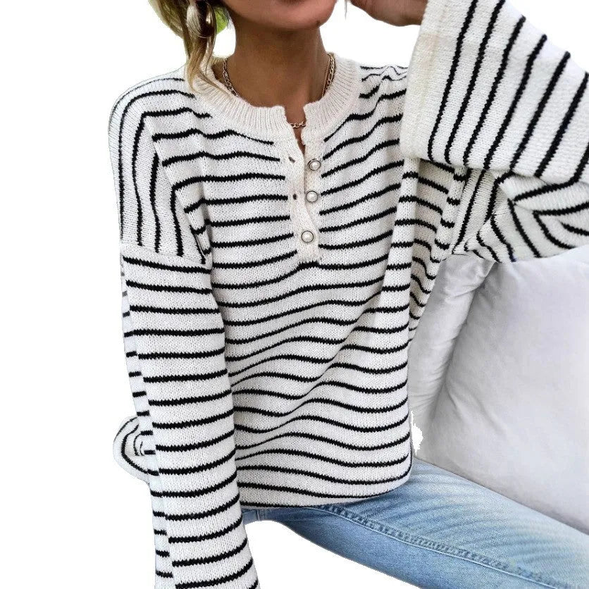 Black and white striped women's casual top with contrast colour detailing and drop-shoulder sleeves