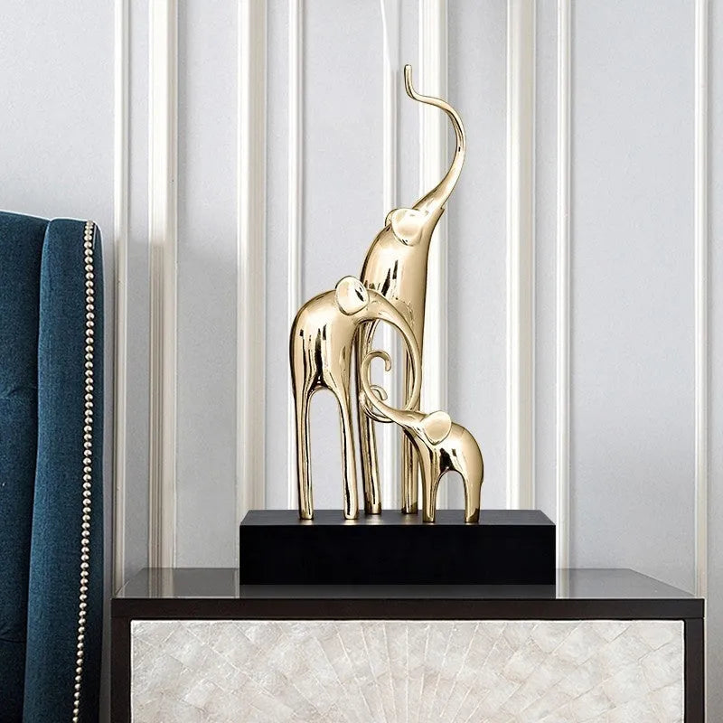 European style resin elephant decorative ornament in bright gold finish displayed on wooden surface